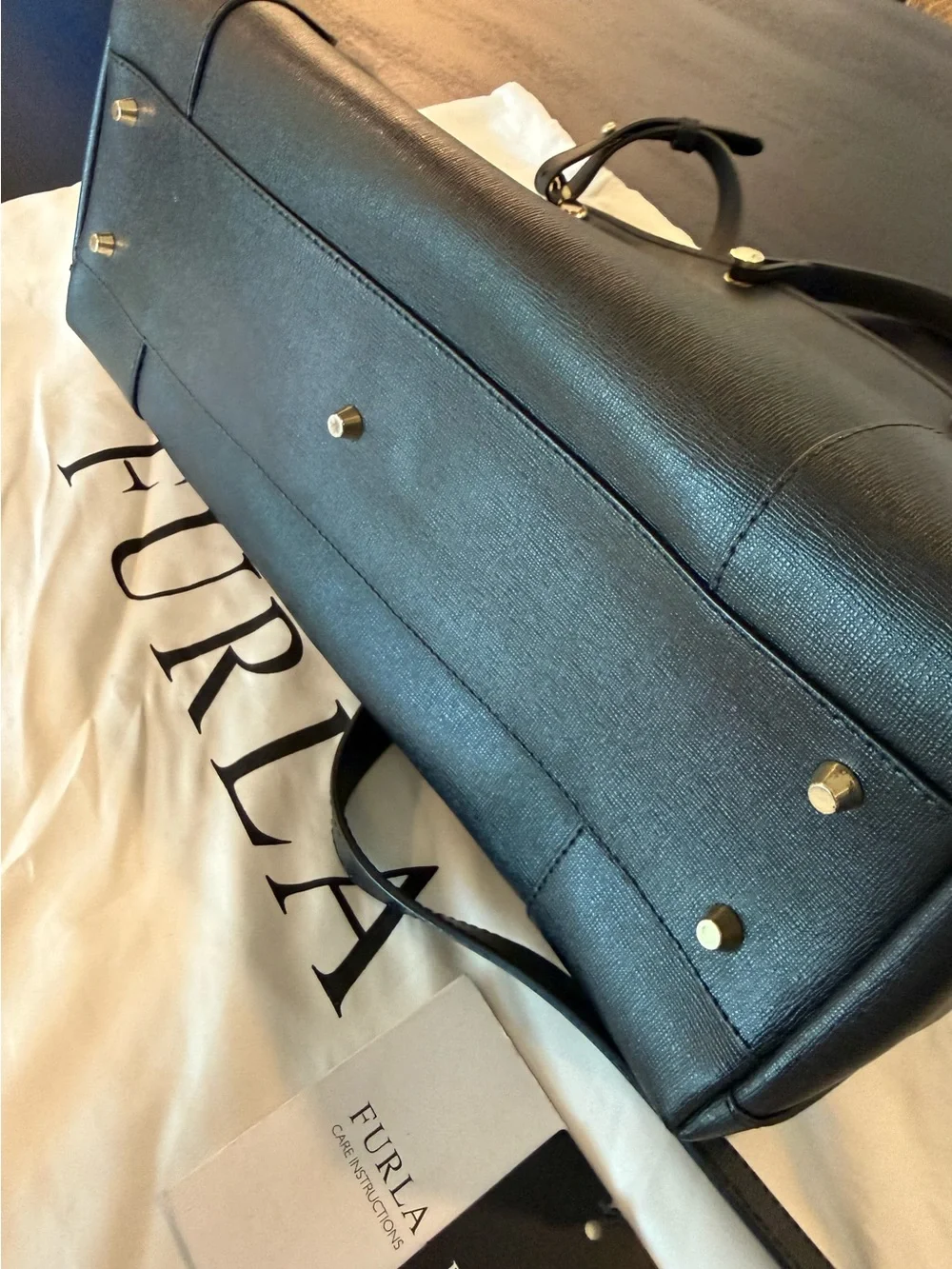 Furla downsizing figured